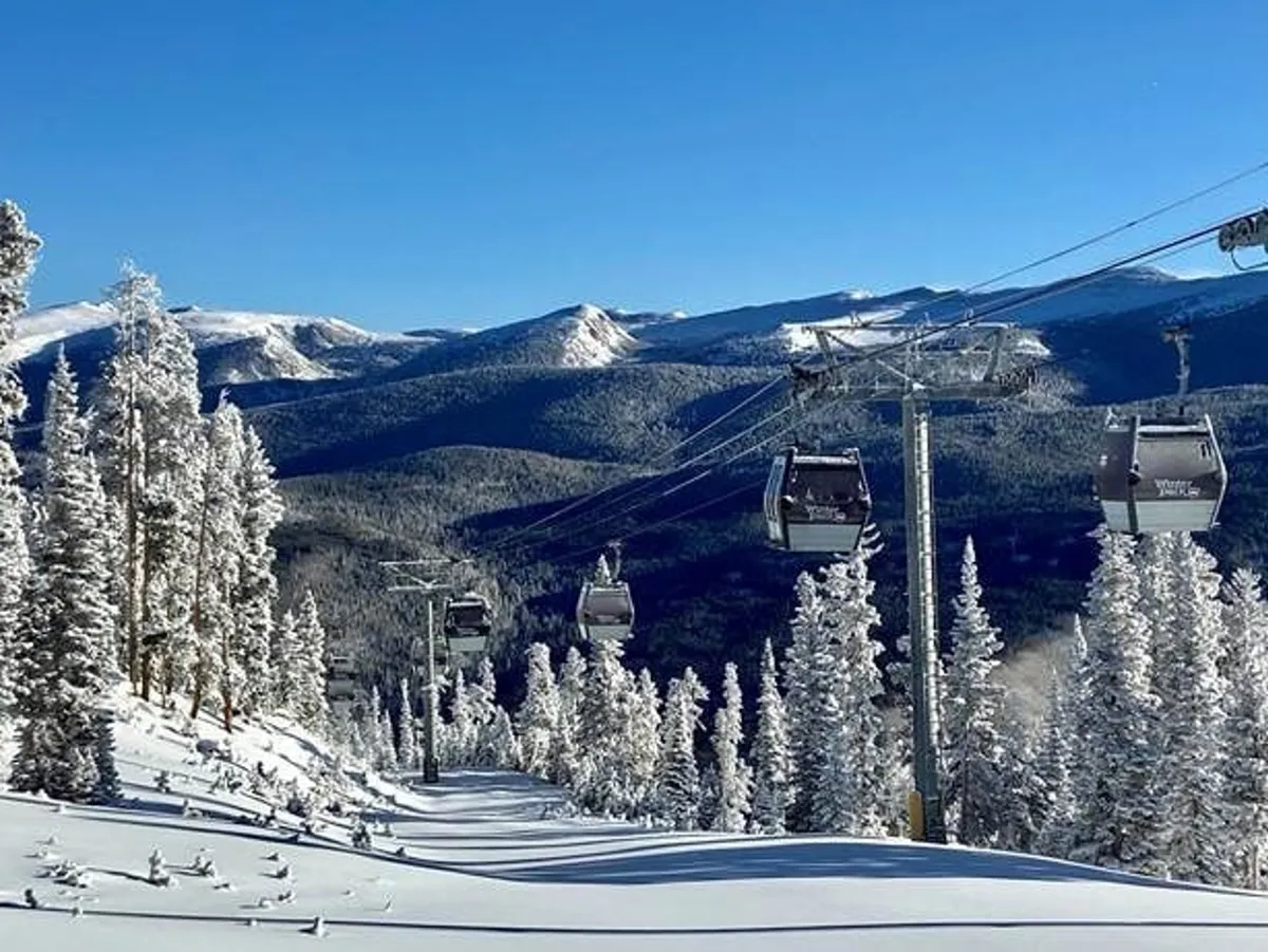 This image captures an exterior mountain setting with a gondola lift, snow-covered slopes, pine trees, and a dramatic mountain range. It evokes outdoor adventure and panoramic views, perfectly aligning with the section's mention of mountain serenity and scenic vistas.